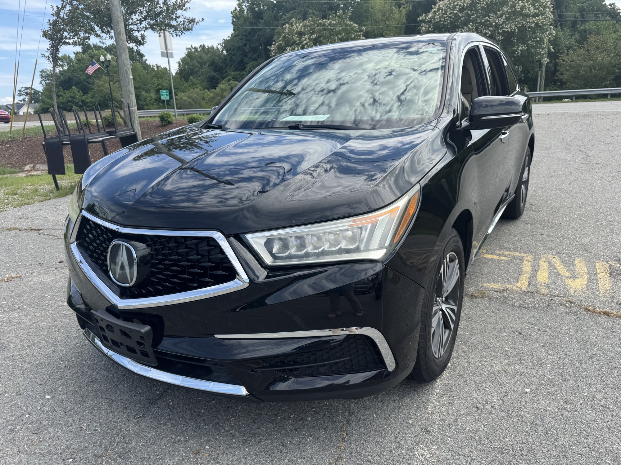 Black Acura MDX SH-AWD on the I&R Auto lot